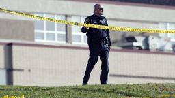 A police officer stands by the scene outside Franklin Regional High School where more then a dozen students were stabbed by a knife wielding suspect on Wednesday, April 9, 2014, in Murrysville, Pa., near Pittsburgh. The suspect, a male student, was taken into custody and is being questioned. (AP Photo/Tribune Review, Brian F. Henry)  PITTSBURGH OUT