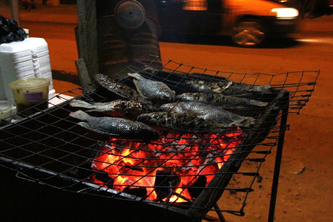 "Scrumptious" is how Muntaka Chasant from Accra, Ghana, describes these grilled tilapia fish. "I try them out about twice in a month at my favorite joint. It can be eaten alone or with 'banku' a whitish paste made from fermented corn or cassava dough, and red/green grinded pepper and onions. This late-night eat is a common street food in the southern part of Ghana." <br /><br />He took this photo of his favorite meal in November 2013 in Accra, but wants to move onto something more adventurous soon: "I would like to try grilled spicy snails. They are not usually found in Accra, so I haven't had one yet," he said. 