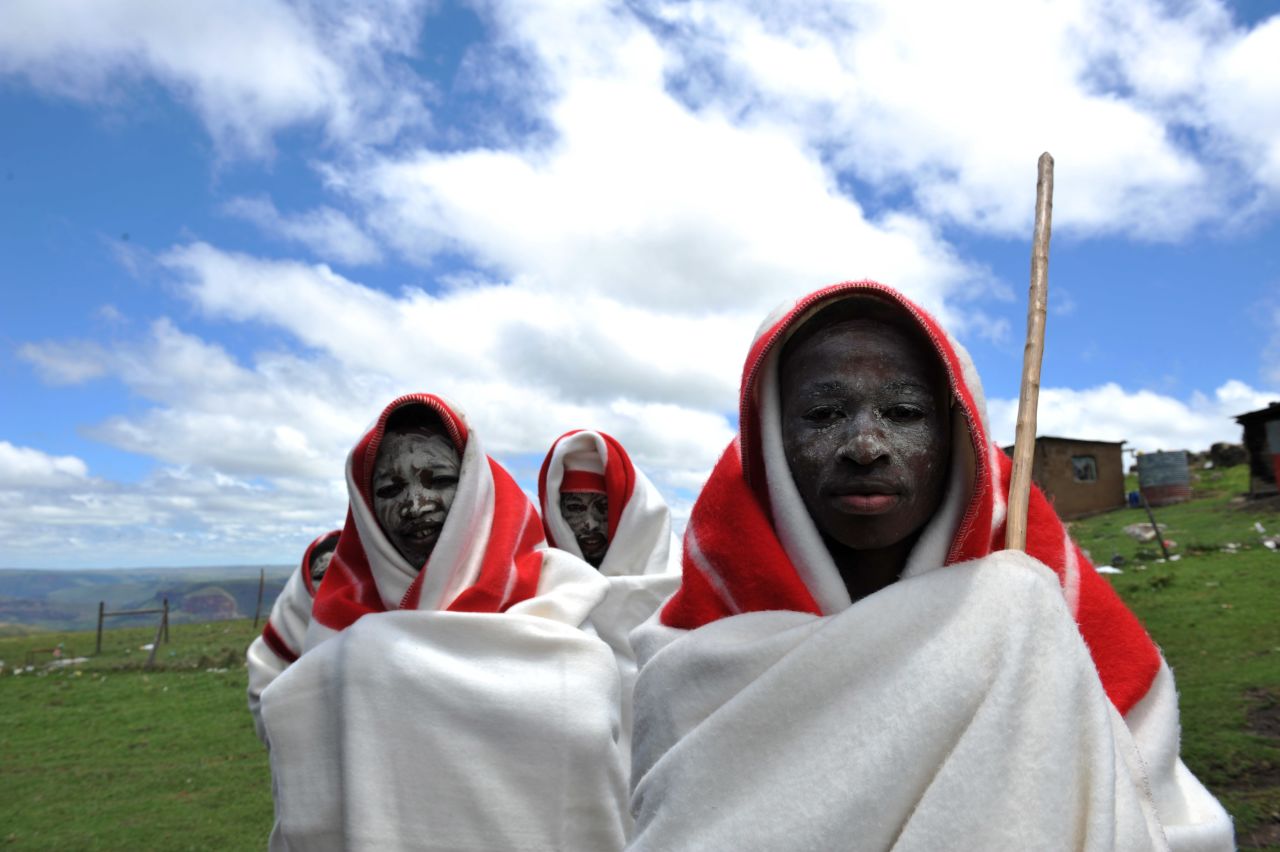 For the initiation, Xhosa boys don traditional outfits and paint their faces in clay before they are circumcised by a traditional healer.