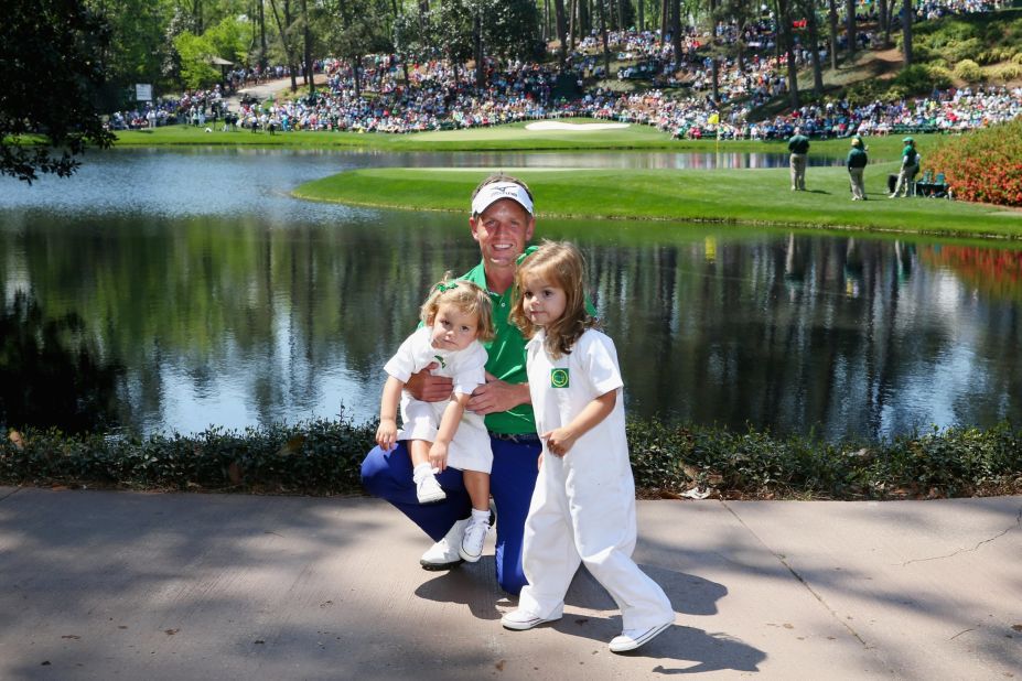 England's Luke Donald poses with his daughters Elle and Sophia Ann at Augusta.