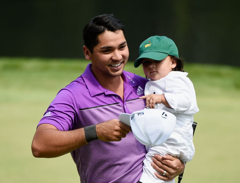 World No.4 Jason Day of Australia shows his son, Dash, around the course at Augusta.