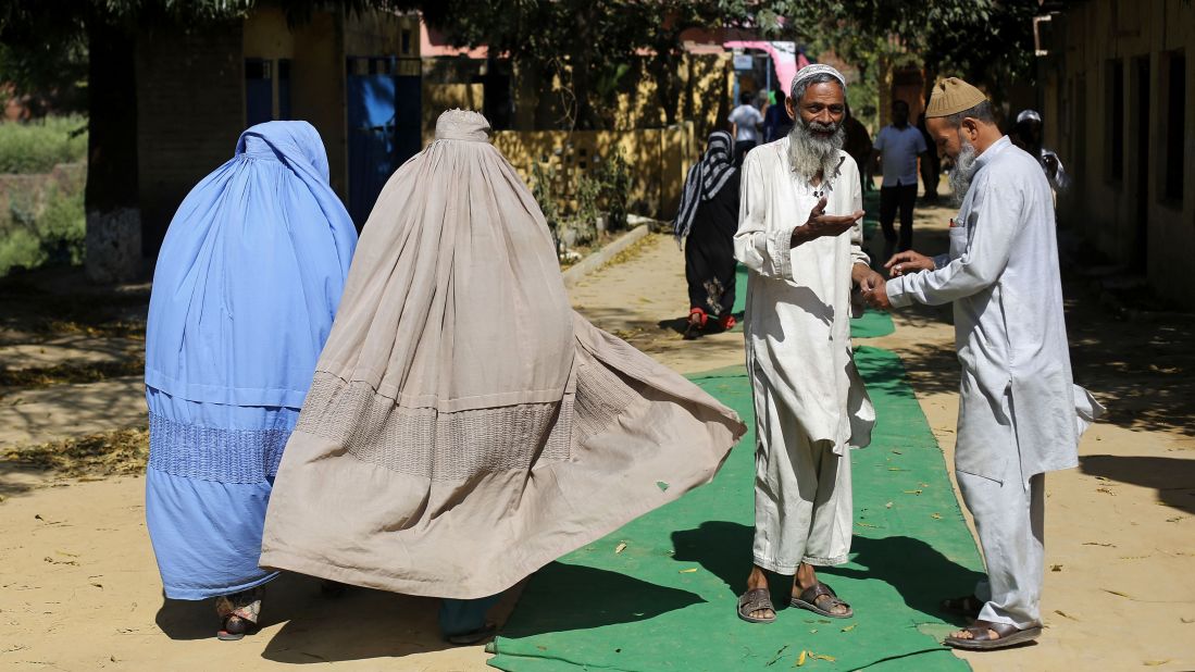Voters leave a polling station in Muzaffarnagar on April 10.