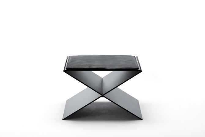 This <a href="index.php?page=&url=http%3A%2F%2Fwww.livingdivani.it%2FIT%2FHome.aspx" target="_blank" target="_blank">Living Divani</a> minimalist stool, by Spanish designer David Lopez Quincoces, combines two aluminum plates which create an X-shaped seat. Its clean, geometric lines are softened by a slim, elegant cushion. 