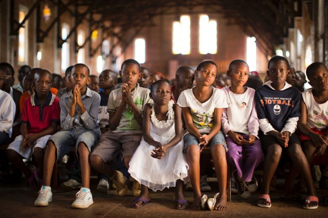 Children pray at a Catholic church in Kigali, Rwanda, on Sunday, April 6. Twenty years ago this month, mass killings began in Rwanda. An estimated 800,000 civilians, mostly from the Tutsi ethnic group, <a href="http://cnnphotos.blogs.cnn.com/2014/04/03/like-being-in-the-valley-of-death/">were murdered</a> over a period of about 100 days.