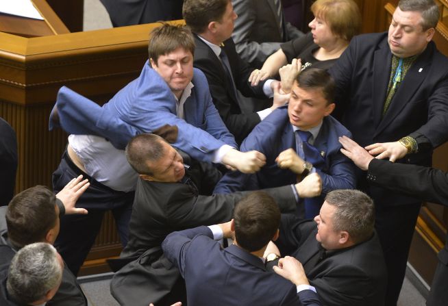 Lawmakers scuffle during a parliament session in Kiev, Ukraine, on Tuesday, April 8. The fight broke out when Petr Simonenko, the leader of the Communist Party, began to say lawmakers should listen to the demands of eastern Ukraine. He defended demonstrators who have seized local government buildings, saying they are not doing anything different from what the current interim government has done. He also accused "nationalists" of starting <a href="http://www.cnn.com/2014/03/26/world/gallery/ukraine-crisis/index.html">the crisis in eastern Ukraine</a>.
