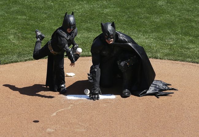 Miles Scott, dressed as Batkid, <a href="http://www.cnn.com/2014/04/09/us/gallery/batkid-throws-first-pitch/index.html">throws the ceremonial first pitch</a> at the San Francisco Giants' home opener on Tuesday, April 8. Miles, a 5-year-old who has been fighting leukemia since he was a baby, made headlines in November when, through the Make-A-Wish Foundation, he became Batman for a day and got to "save" the city.