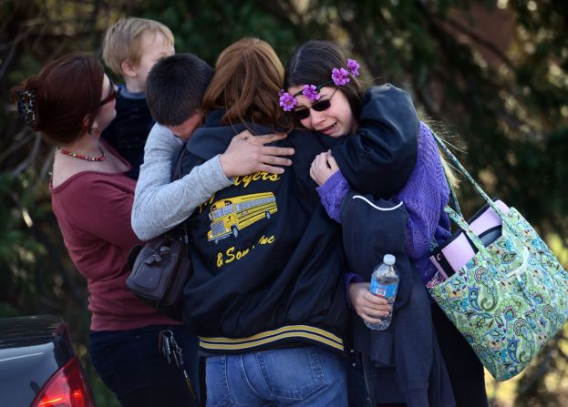 Parents and students embrace near Franklin Regional High School, where authorities say 21 people were injured in a <a href="http://www.cnn.com/2014/04/09/us/gallery/pennsylvania-high-school-stabbings/index.html">stabbing spree</a> Wednesday, April 9, in Murrysville, Pennsylvania. A 16-year-old student, Alex Hribal, has been charged with four counts of attempted homicide and 21 counts of aggravated assault.