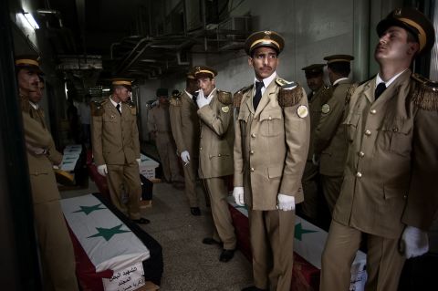 Here, Brooks captures the Syrian army holding a funeral service at the Tishreen Military Hospital in Damascus, for 42 government soldiers killed in fighting against insurgents. 