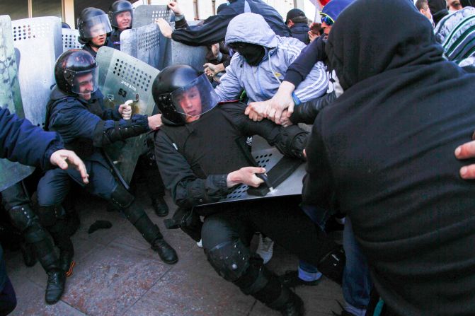 Pro-Russian activists clash with police at the regional administration building in Donetsk, Ukraine, on Sunday, April 6. Protesters <a href="http://www.cnn.com/2014/03/26/world/gallery/ukraine-crisis/index.html">seized state buildings</a> in several east Ukrainian cities, prompting accusations from Kiev that Moscow is trying to "dismember" the country.