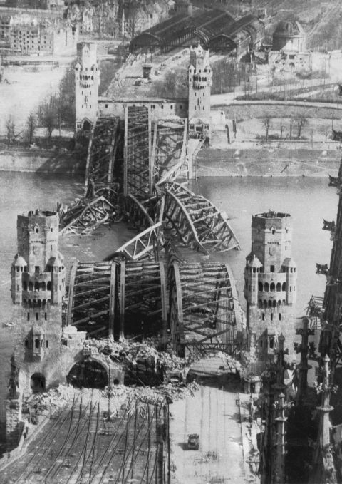 While crossing the Atlantic to North Africa, Bourke-White's transport ship was torpedoed and sunk, but she survived and continued to cover World War Two. In this photo from 1945, she shows the Hohenzollern Bridge over the Rhine in Cologne in ruins.
