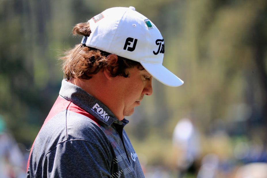 No wonder his head is down. Jason Dufner, paired with Scott, fired an 8-over 80. 