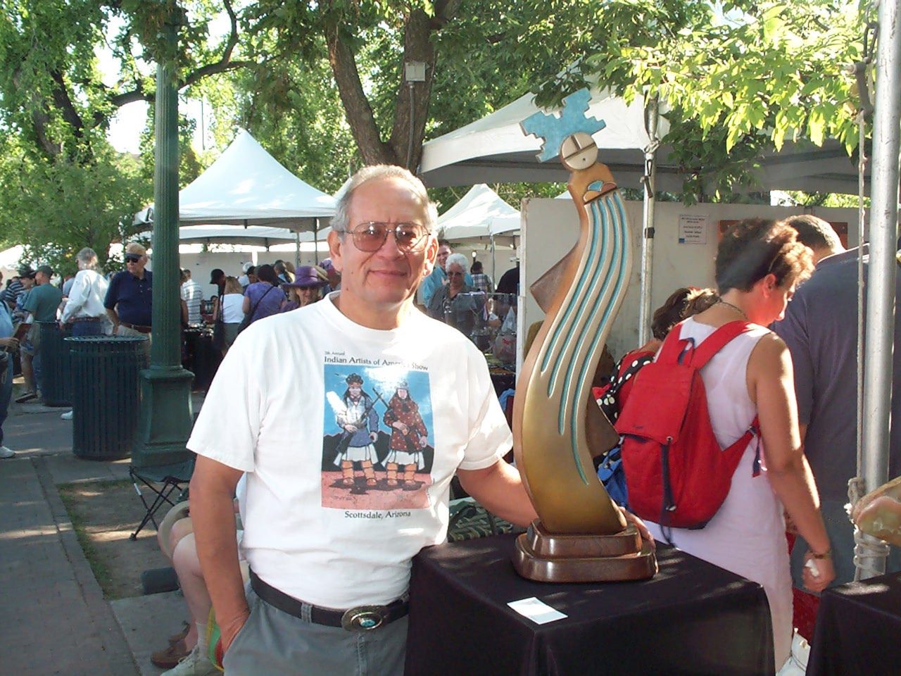 Artist Upton Greyshoes Ethelbah at his booth during the Santa Fe Indian Market.