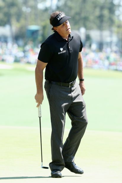 Phil Mickelson is seeking a fourth title at Augusta but struggled at the seventh hole, hitting a triple bogey. 