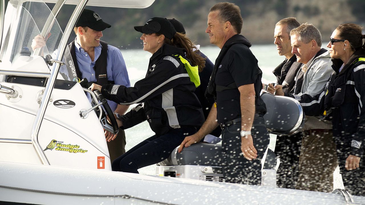 William, left, hangs on as Catherine drives a boat to Westpark Marina in Auckland, New Zealand, on Friday, April 11.