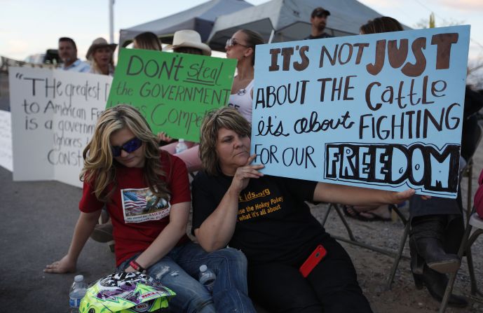 Krissy Thornton, right, and Burgundy Hall protest the cattle roundup on Wednesday, April 9. 