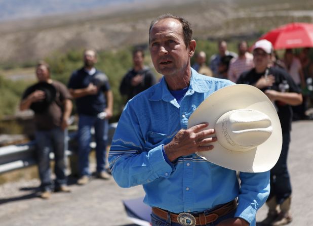 Chris Miller holds his hand over his heart during a rally in support of Bundy on April 7.
