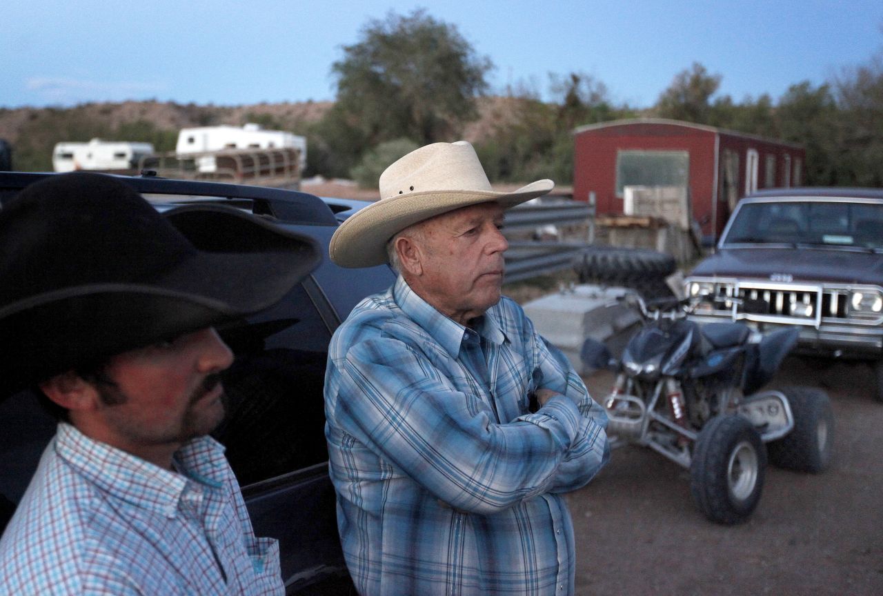 Cliven Bundy, right, and Clance Cox stand at the Bundy ranch on April 5.