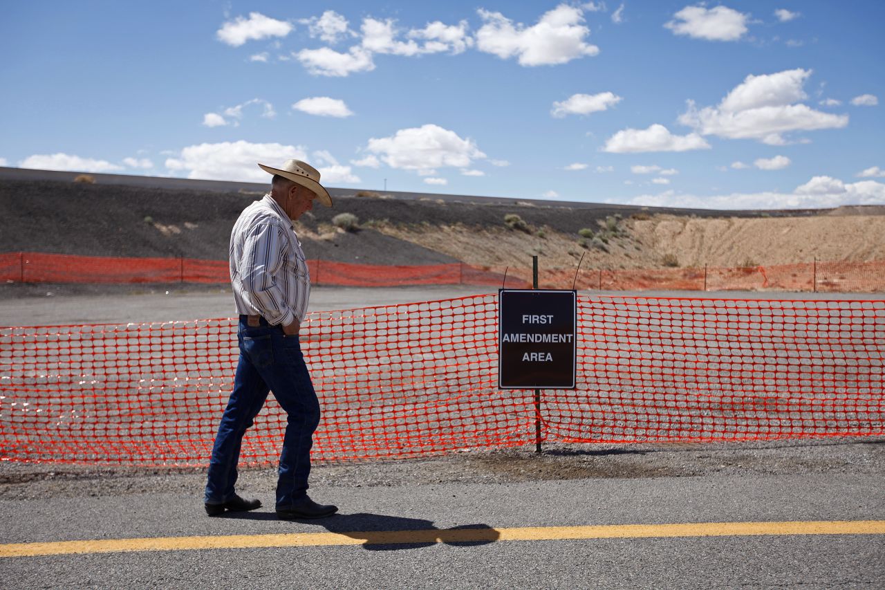 Bundy walks by a free speech area set up by the Bureau of Land Management on Tuesday, April 1.