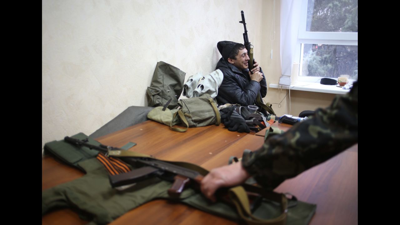 Armed pro-Russian protesters occupy the Security Service building in Luhansk on April 10.