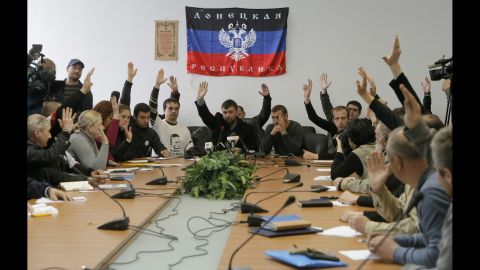 Members of the self-proclaimed government the "Donetsk Republic" vote April 10 during a meeting at the seized regional administration building in Donetsk.