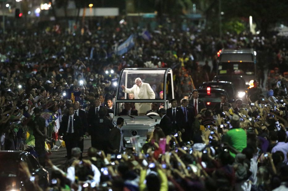 Crowds swarm the Pope as he makes his way through World Youth Day in Rio de Janeiro in July 2013. According to the Vatican, 1 million people turned out to see the Pope. 