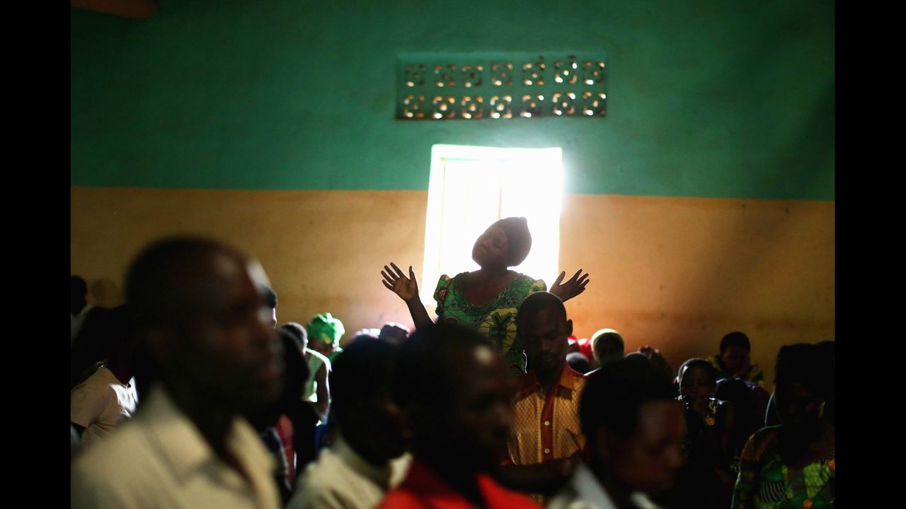 Rwandans worship during a Sunday service at the Chapel Mbyo on April 6 in Mybo. Some scholars say Christian leaders gave moral sanction to the genocide. 
