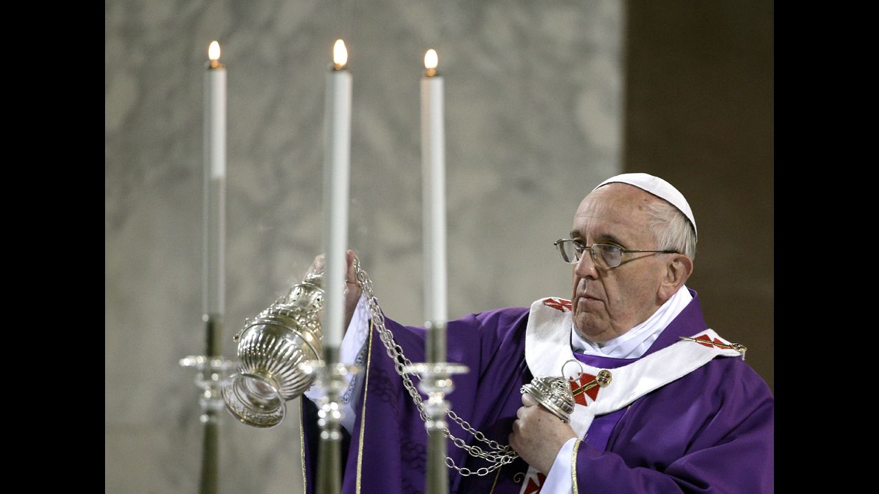 The Pope blesses the altar at Rome's Basilica of Santa Sabina as he celebrates Mass on Ash Wednesday in March 2014.