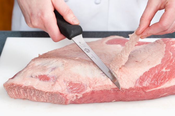 TRIM THE FAT: Use a knife to trim the brisket's fat cap to 1/4-inch.<br />WHY? You want a glossy sauce, not a greasy one.