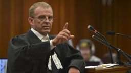 State prosecutor Gerrie Nel attends a hearing of South African Paralympic athlete Oscar Pistorius' trial at the North Gauteng High Court in Pretoria on March 12, 2014. Oscar Pistorius's murder trial saw a dramatic re-enactment of how the toilet door he shot his girlfriend though was damaged by gunshots and a cricket bat. AFP PHOTO / POOL / ALEXANDER JOEALEXANDER JOE/AFP/Getty Images