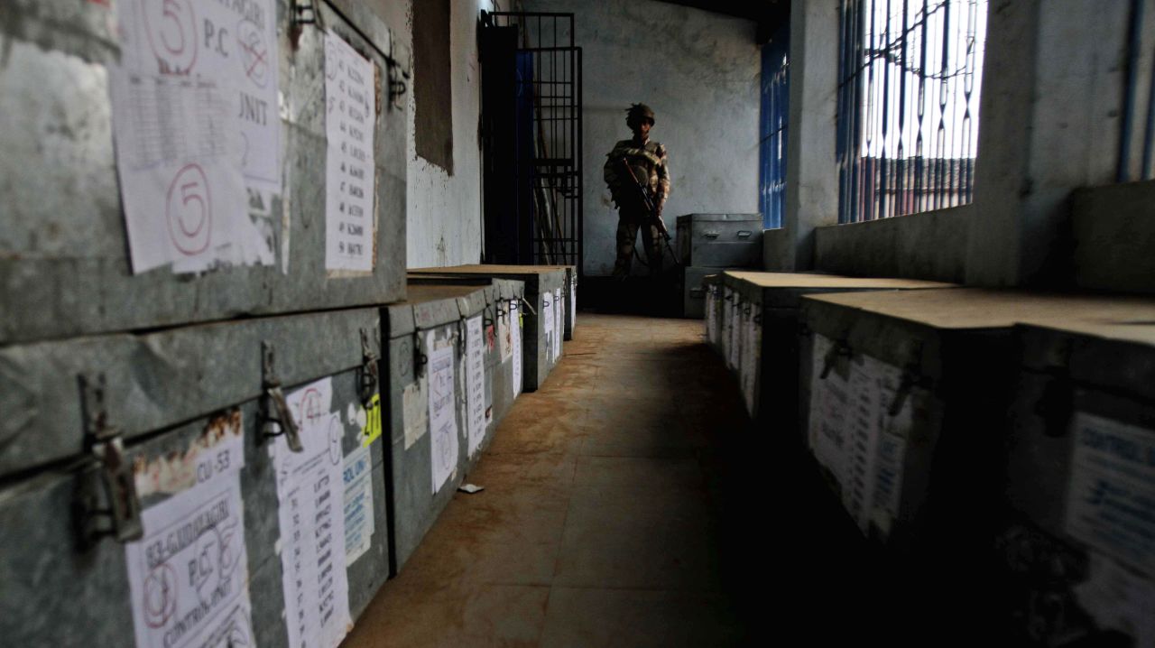 A paramilitary soldier stands guard inside a room containing ballot boxes on April 10.