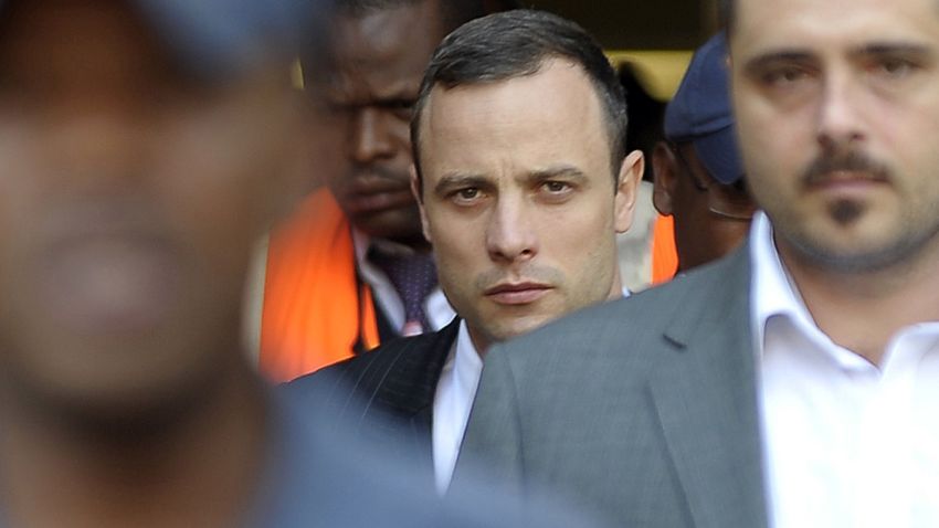 South African Paralympic track star Oscar Pistorius (C) leaves the North Gauteng Hight Court in Pretoria on April 11, 2014, during his ongoing murder trial. The prosecution angrily accused Oscar Pistorius of tailoring evidence and overplaying his deep fear of crime on April 11 to justify shooting dead his girlfriend Reeva Steenkamp. AFP PHOTO / MUJAHID SAFODIENMUJAHID SAFODIEN/AFP/Getty Images
