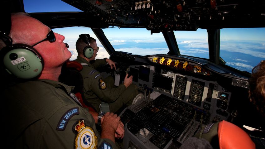 A Royal New Zealand Air Force P-3 Orion is flown by Flt. Lt Tim McAlevey back, in the search for missing Malaysia Airlines Flight MH370 over the Indian Ocean, Friday, April 11, 2014.