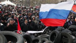 Pro-Russian activists rally at a barricade outside the regional state administration in the eastern Ukrainian city of Donetsk on April 11, 2014. Ukraine's embattled premier vowed on Friday to grant more power to the country's regions in a bid to stamp out a separatist insurgency that sprang up just as a new Russian gas war threatened European supplies. Prime Minister Arseniy Yatsenyuk's promise during a visit to the coal mining region of Donetsk came as militants armed with Kalashnikovs barricaded themselves inside the local government building and demanded a referendum on joining Russia. AFP PHOTO/ ANATOLII STEPANOVANATOLII STEPANOV/AFP/Getty Images
