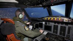 Captain Flt. Lt. Tim McAlevey of the Royal New Zealand Air Force flies a P-3 Orion in search for the missing Malaysia Airlines Flight 370 over the Indian Ocean, Friday, April 11, 2014. Authorities are confident that signals detected deep in the Indian Ocean are from the missing Malaysian jet's black boxes, Australian Prime Minister Tony Abbott said Friday, raising hopes they are close to solving one of aviation's most perplexing mysteries. Abbott told reporters in Shanghai that crews hunting for Flight 370 have zeroed in on a more targeted area in their search for the source of the sounds, first heard on Saturday. (AP Photo/Richard Wainwright, Pool)