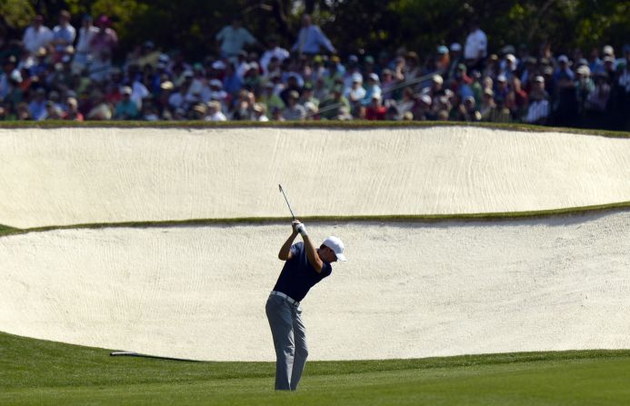 American Jordan Spieth moved up the leaderboard Saturday at the Masters, tied for first with Bubba Watson at 5-under. He is trying to become the first player since 1979 to win the Masters on his debut. 