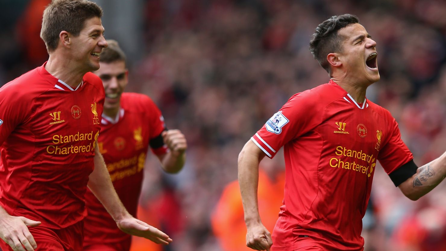 Philippe Coutinho celebrates his winning goal at Anfield with skipper Steven Gerrard.