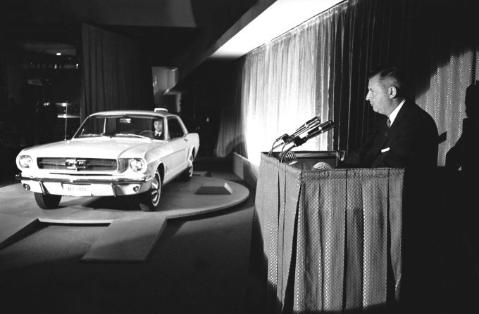 The 1965 Ford Mustang is officially revealed at the New York World's Fair in Flushing, New York, on April 17, 1964. Standard equipment for the car included carpet, bucket seats and a 170-cubic-inch, six-cylinder engine that was coupled with a three-speed floor-shift transmission.