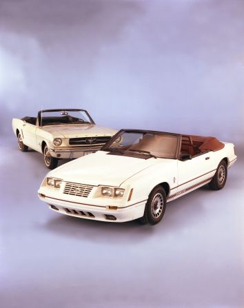 <strong>1984 Ford Mustang convertible, right, and 1965 Mustang.</strong> For the 20th anniversary edition Mustang, a special V-8-powered GT model was offered -- painted Oxford White with Canyon Red interior -- in either coupe or convertible form.