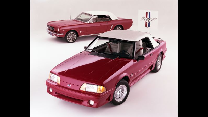 <strong>1990 Ford Mustang convertible, front, and 1965 Ford Mustang convertible. </strong>In 1990, Ford added a driver's-side airbag as standard equipment.