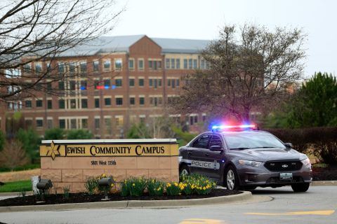 A police car is seen at the entrance of the Jewish Community Center on April 13.