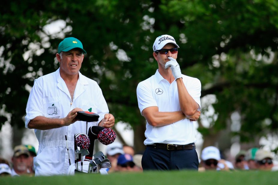 Defending champion Adam Scott is in pensive mood as he weighs a shot with caddie Steve Williams on his way to a closing 72.