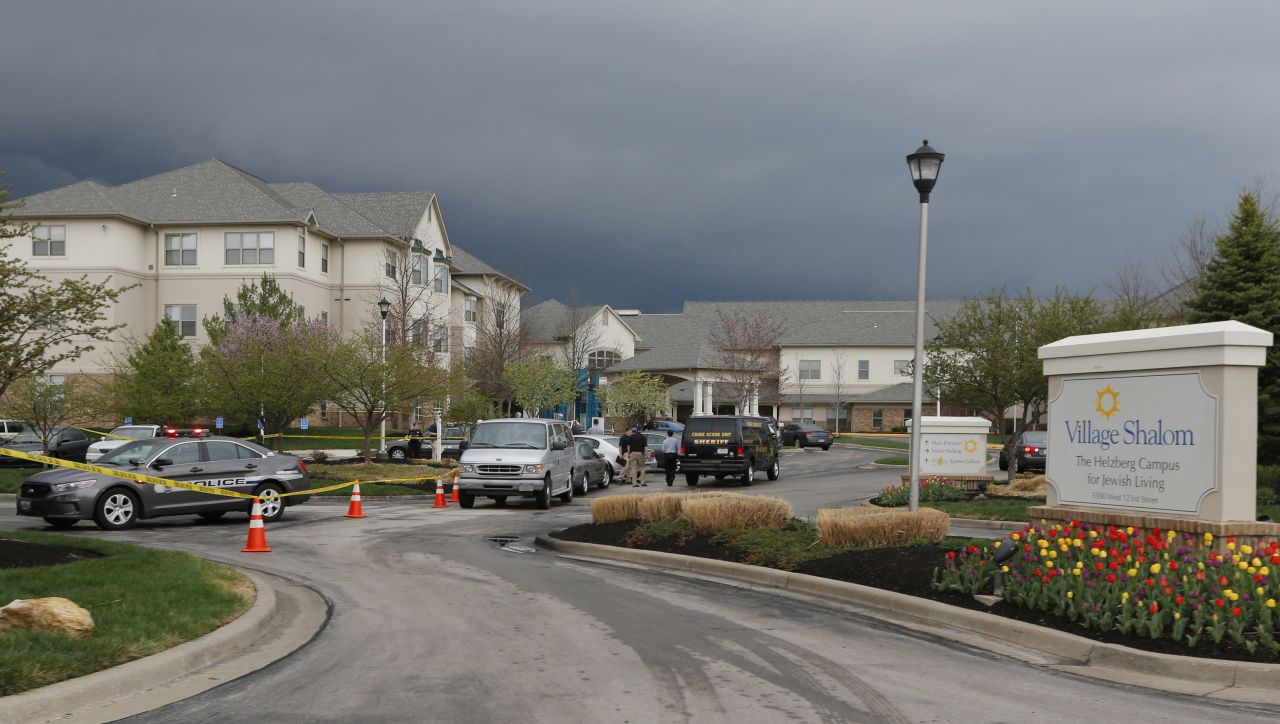 Investigators work the scene of a shooting at the Village Shalom Retirement Community in Leawood, Kansas, on April 13.