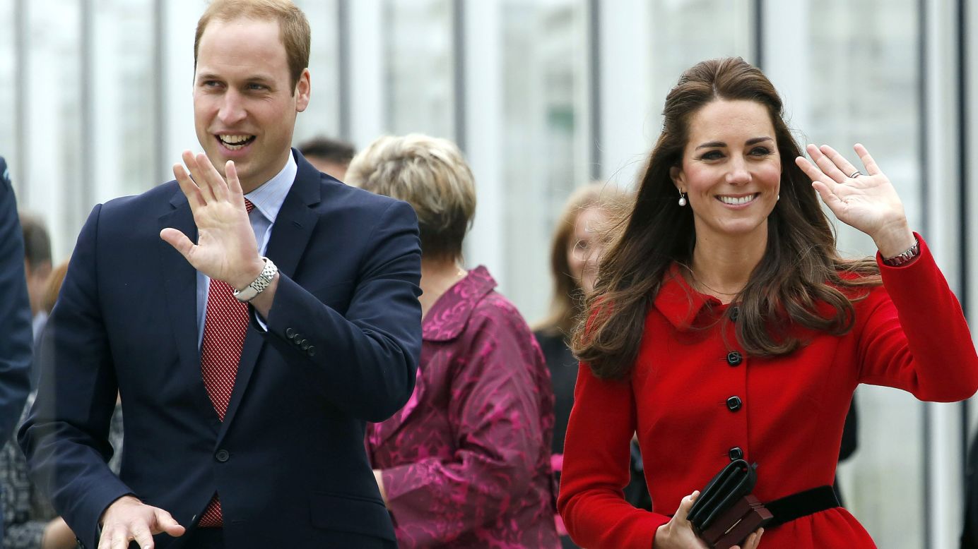 The royal couple wave after their tour of the new visitors center at New Zealand's Christchurch Botanic Gardens on Monday, April 14.