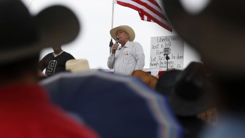 Cattle rancher Cliven Bundy talks to his supporters Friday, April 11, in Bunkerville, Nevada. They had been protesting the federal government's roundup of Bundy's cattle, which led to an Old West-style showdown last week. The government says Bundy's livestock has been illegally grazing on U.S. lands for 20 years. Bundy says his family's cattle has grazed on the land since the 1800s.