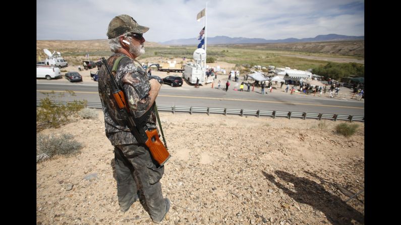 Brand Thornton carries a rifle at a protest site in Bunkerville on April 11. The controversy drew armed militia groups from across the country to Bundy's side. The Bureau of Land Management stopped rounding up Bundy's cattle on Saturday, April 12, and it says it returned about 300 head of cattle to the open range to avoid the potential for violence.