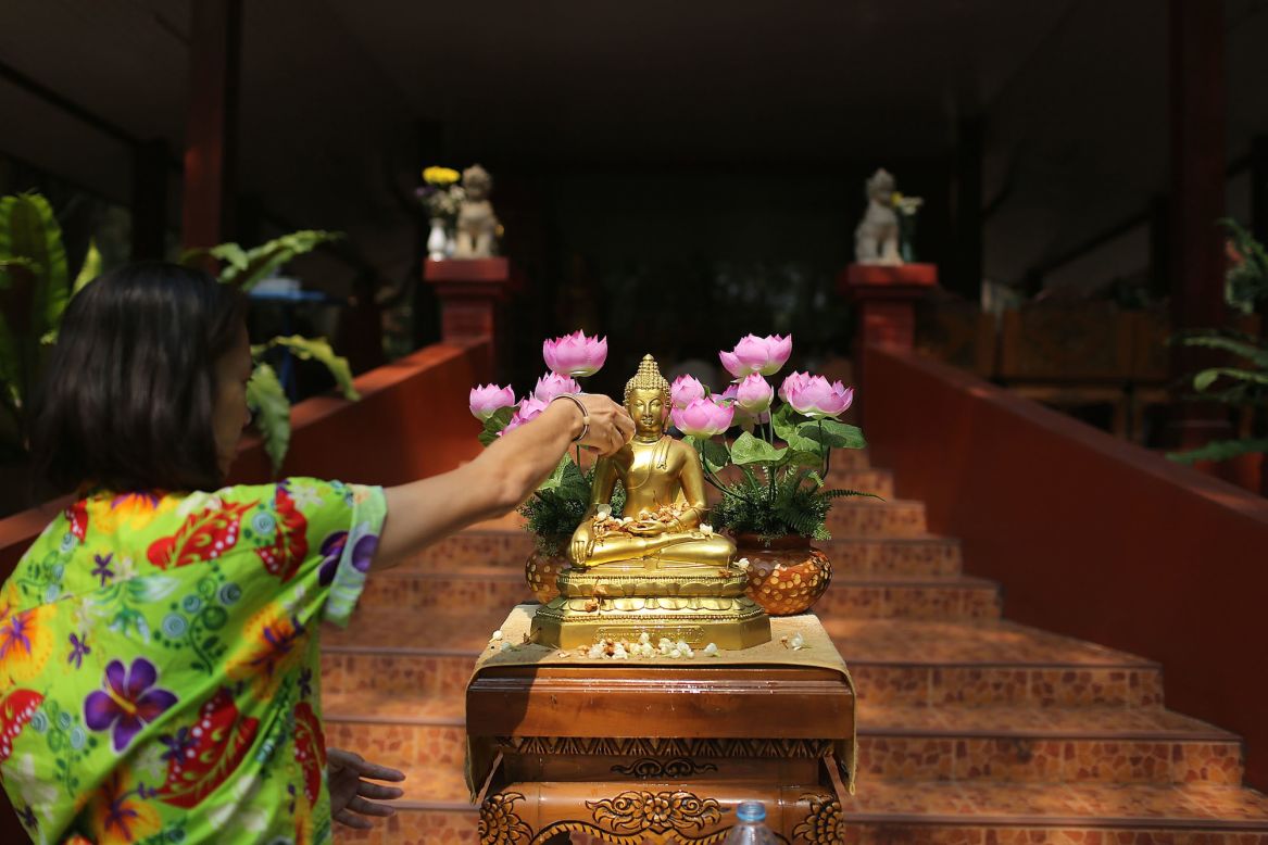 On the first day of festivities, families and friends celebrate by visiting temples and pouring water on each others' hands as a blessing. People also pour water -- seen as a way of washing away bad luck -- over Buddha statues.  