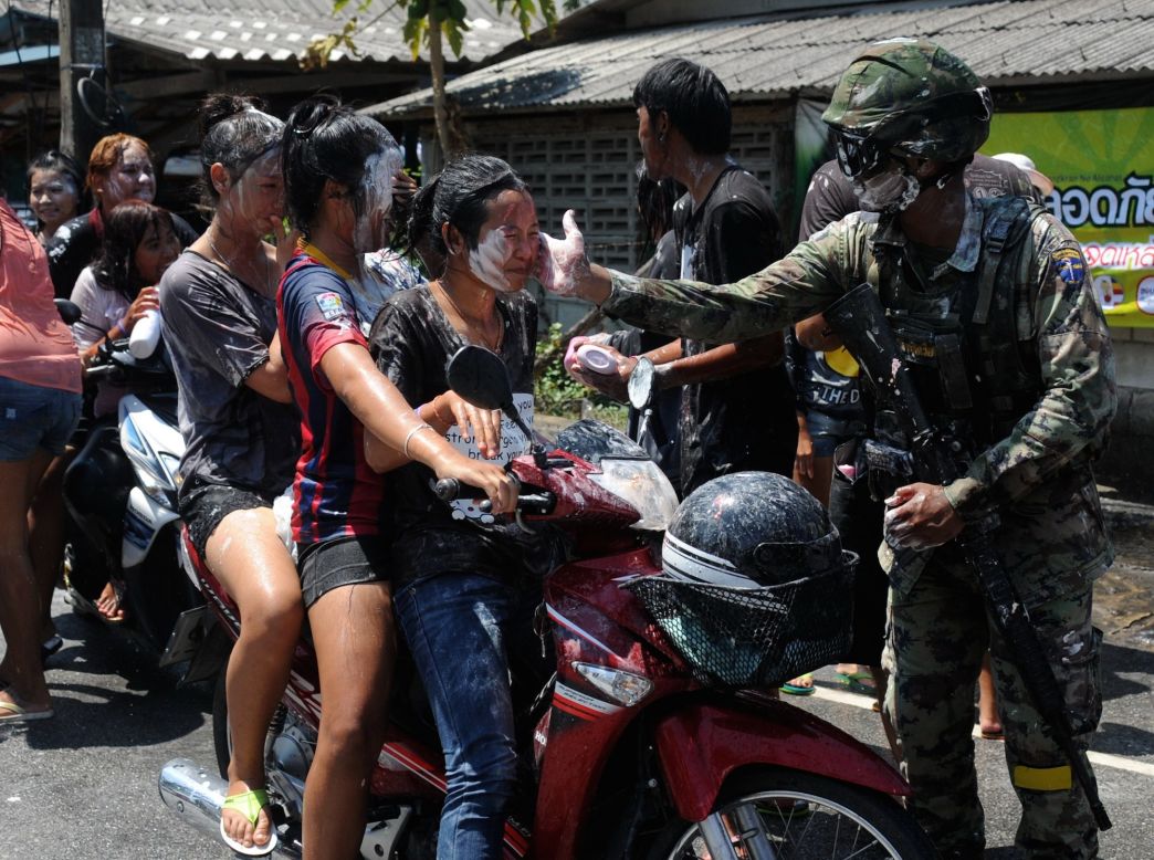 A Thai soldier gets in on the Songkran act in Thailand's southern Narathiwat Province. 