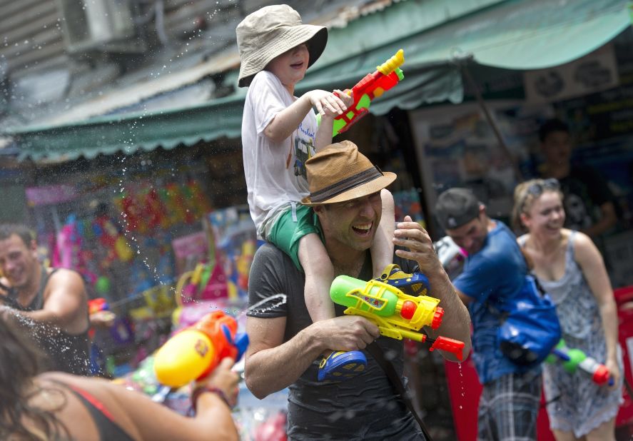 Foreign tourists take part in water battles during Thailand's Songkran Festival at Khao San Road in Bangkok (pictured). Chiang Mai has a reputation for the wildest Songkran festivities. 