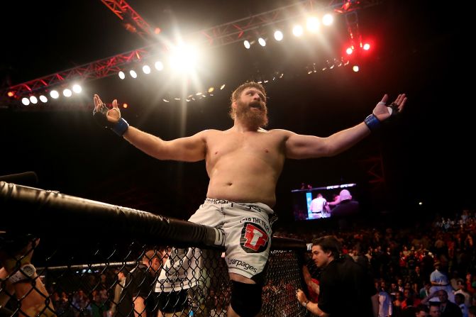 UFC fighter Roy Nelson celebrates on top of the cage Friday, April 11, after knocking out Antonio Rodrigo Nogueira during UFC Fight Night 39. The heavyweight finished Nogueira with a right hand in the first round.