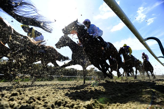 Horses race Wednesday, April 9, at the Lingfield Park Racecourse in Lingfield, England.
